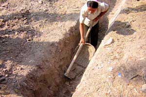 Digging a trench for a biodigester
