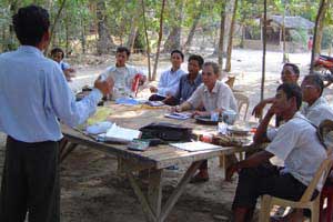 CRDT staff working with villagers